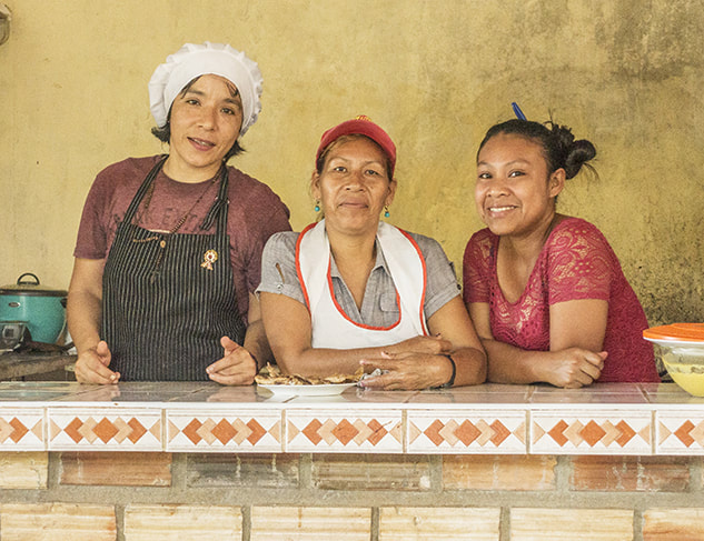Peru, three servers, kitchen workers.