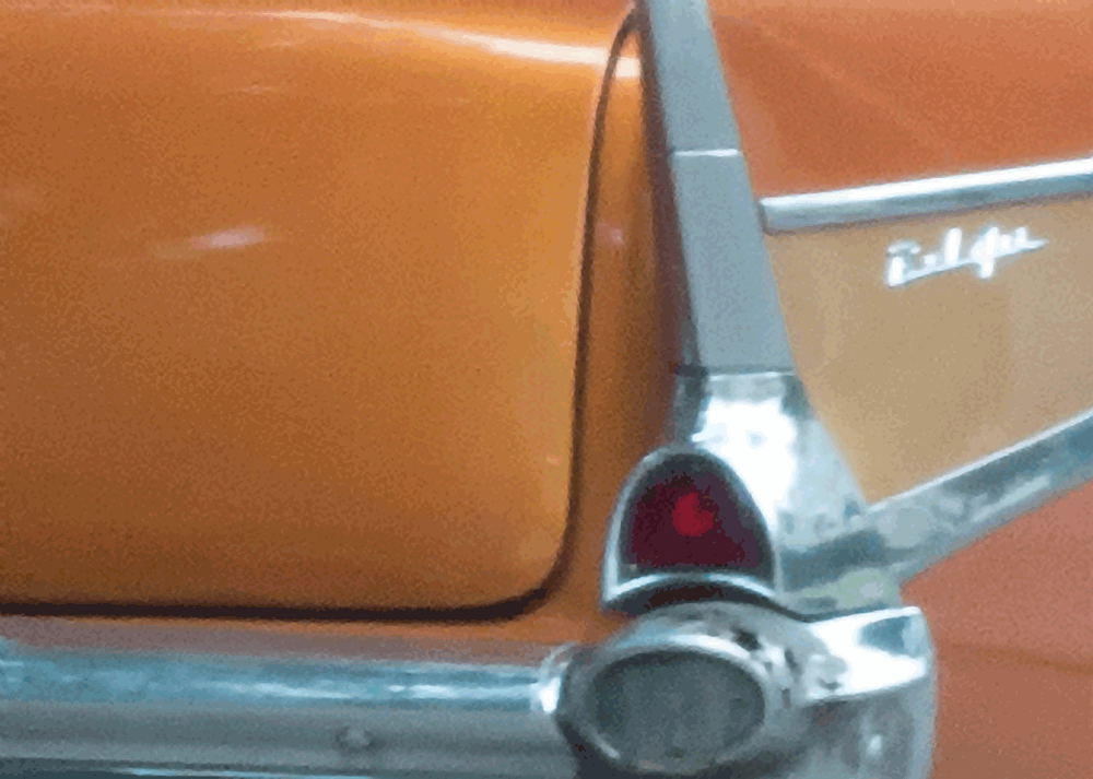 shot of tan Belaire car in cuba