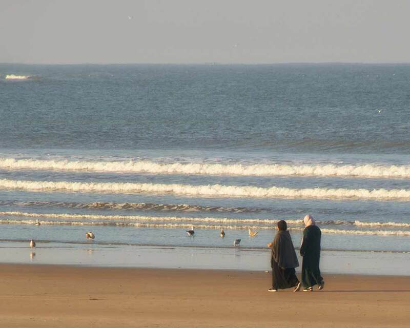 water, ocean, morocco, two women, djellaba