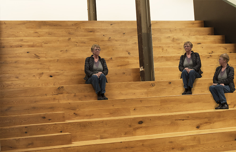 three women sitting, clones