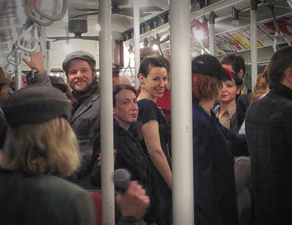 swing dancers on a 1940 style subway in NYC, singer