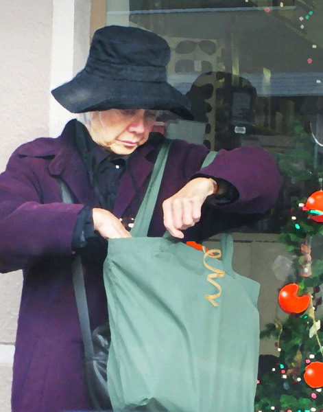 elderly woman, shopping bag, christmas ornament